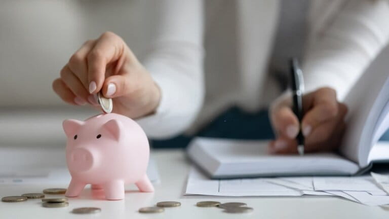 Close-up of woman saving money managing family finances