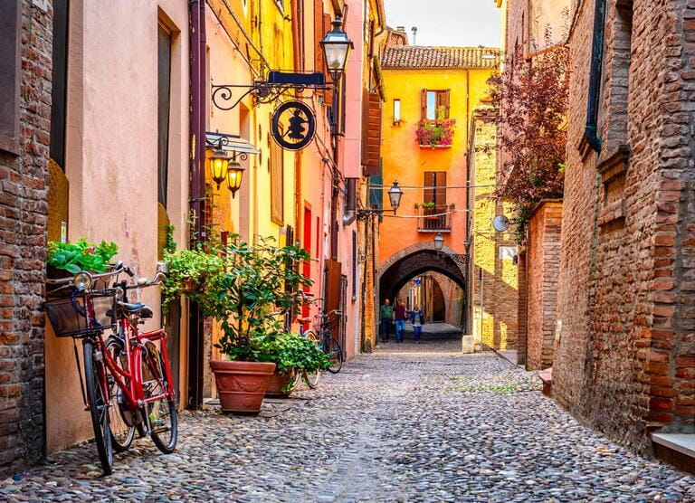 Cozy narrow street in Ferrara, Emilia-Romagna, Italy. Ferrara is the capital of the province of Ferrara.